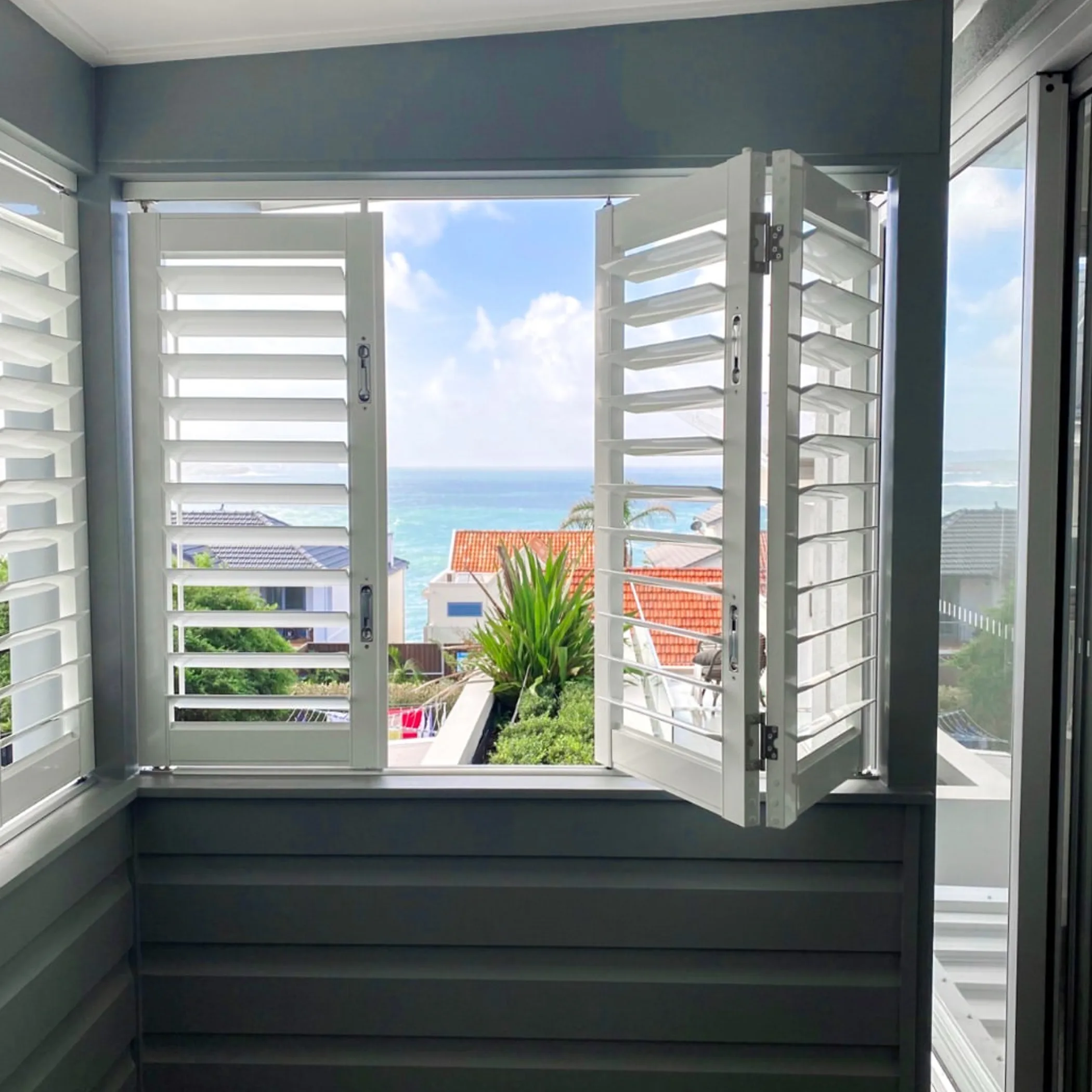 aluminium shutters in coastal home