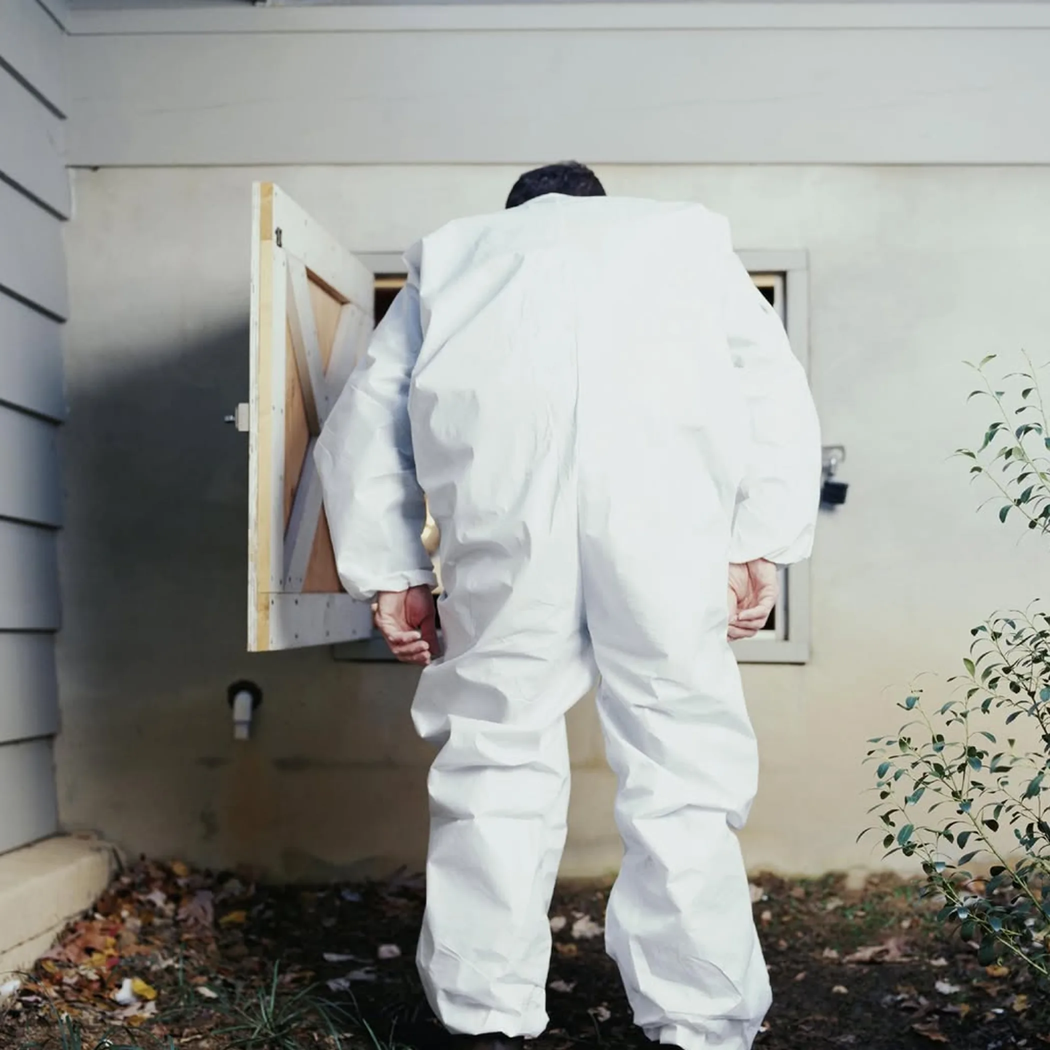 worker performing home maintenance